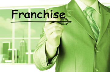 business man writing franchise