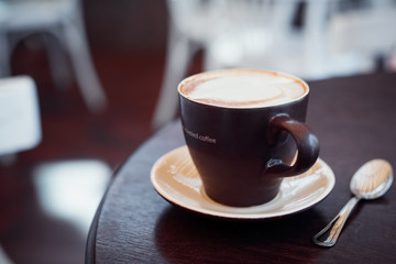 Cup of coffee in a table