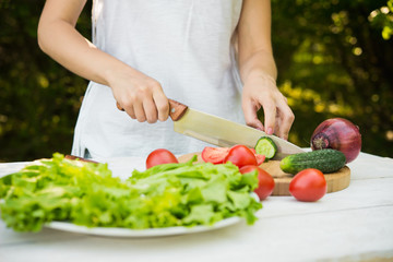 woman chef chopped vegetables