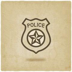 police badge symbol old background