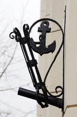 Old stylized flagstaff with anchor on building wall,Odessa