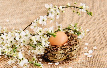 Easter eggs with flowers on burlap 