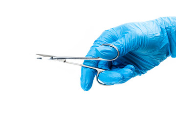 Gloved hand with dental instrument