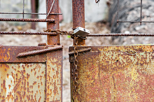 Rusted lock on old gate