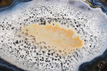 Beautiful color agate slice on a black mirror table