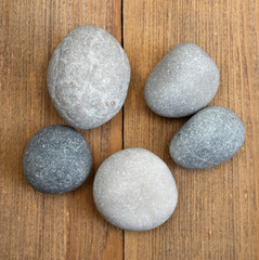 stones on wooden background