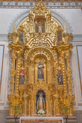 Fototapeta na wymiar Granada - baroque side altar of Saint Anthony of Padua in Iglesia de san Anton