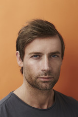 Fototapeta premium Man looking at camera in studio