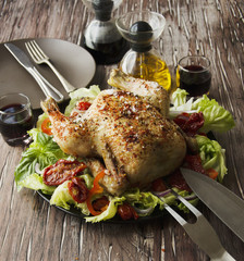  baked chicken with herbs spices ingredients, selective focus