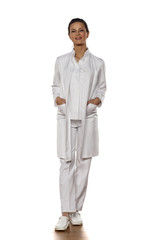 a young woman doctor in uniform on a white background