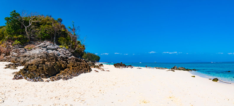 Tropical sandy beach panorama with big rock in the island, Phi P