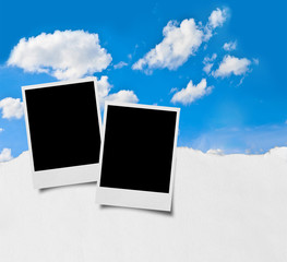 close up of old photo frame on sky and clouds background