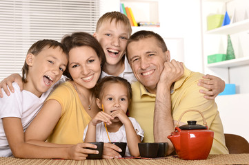 Family drinking tea