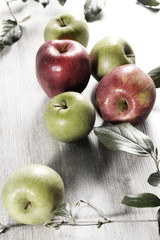 various apples on a wooden tabletop