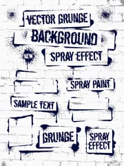 Fotobehang Graffiti Diverse Spray paint graffiti op bakstenen muur. Frame met zwarte inktvlekken. Spray grunge achtergrond.