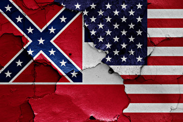 flags of Mississippi and USA painted on cracked wall
