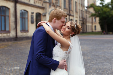 The bride groom gently embraced