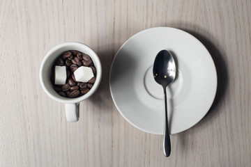 coffee beams, sugar, scoop and cup, view from above;