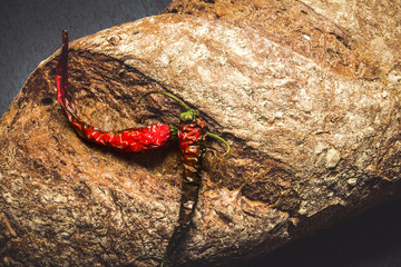 bread on a dark background with chilli