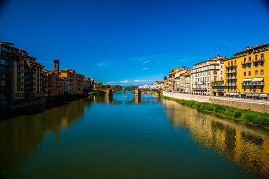 Pone Vecchio over Arno river in Florence, Italy. Beautiful image of italian renaissance architecture. Travel imagery of Italy.