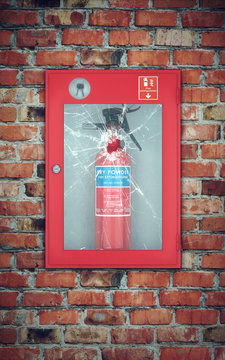 Fire Extinguisher In Wall Box With Cracked Glass. Brick Wall
