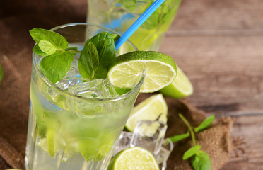 Mojito drink on old wooden background