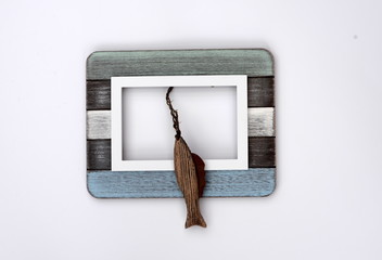 out of the frame, wooden fish with a wooden frame