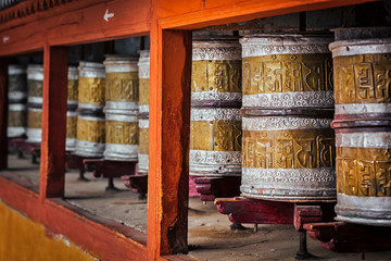 Obraz na płótnie Canvas Buddhist prayer wheels in Hemis monstery, Ladakh