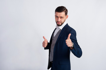 Studio photo of the young guy in a suit