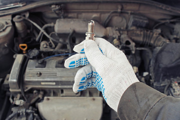 A new spark plug in hand