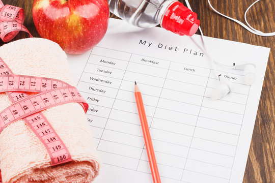 Diet plan, apple and towel