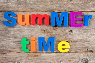 Letter magnets spelling text Summer time