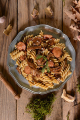 Fussili pasta with mushrooms and sausage