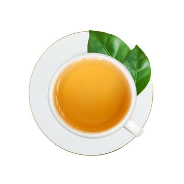white cup with tea and green leaves isolated on white