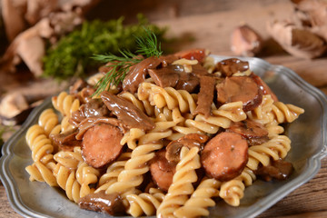Fussili pasta with mushrooms and sausage