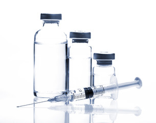 Glass Medicine Vials and Syringe on white background