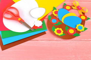 Sheets of colored paper, scissors, glue, pencil, Easter basket and eggs - set for children art