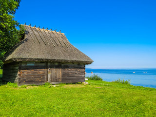 Fototapeta na wymiar Old rural shed on the coast of the Baltic Sea, Estonia
