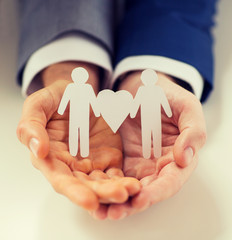 close up of happy male gay couple with love symbol