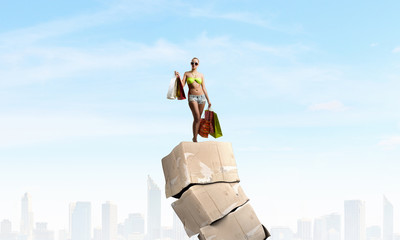 Girl on pile of boxes