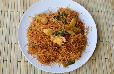 stir-fried thin rice noodle with black sweet soy sauce on dish