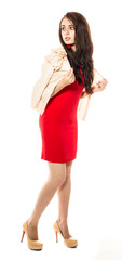 Beautiful young brunette model in red dress.