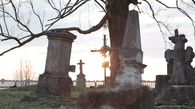 It is very old cemetery. There are many graves from 16 to 21 centuries. It was shot just before sunset therefore some lightflares are very real. Full HD video shot with Canon 6d 25fps and slider.