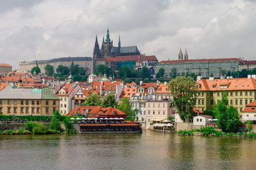 Fototapeta premium View of colorful old town, Prague castle and St. Vitus Cathedral with river Vltava, Czech Republic