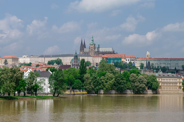 Fototapeta na wymiar View of colorful old town, Prague castle and St. Vitus Cathedral with river Vltava, Czech Republic