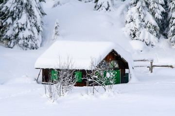 Small chalet in the snow of the dolomites