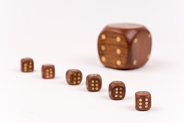 Dices in selective focus over white background