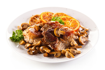 Grilled beefsteaks and vegetables