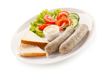 Easter breakfast - eggs, boiled white sausages and vegetables