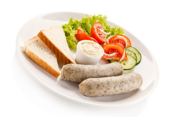 Easter breakfast - eggs, boiled white sausages and vegetables